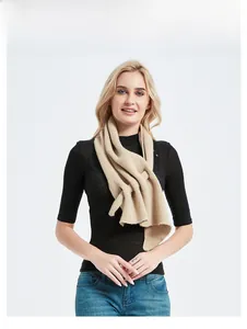 Detail view of the chunky ribbed knit texture on this khaki triangle scarf for women