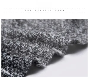 Detailaufnahme der grau-weißen Stricktextur und weichen gewebten Fasern des Schals