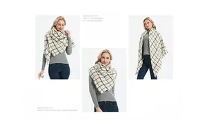 Detail of black and white checkered scarf with tassel edges and thick cashmere-like texture