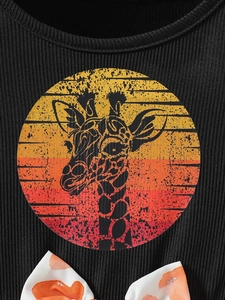 Girls black ribbed summer dress with vintage giraffe print and orange bow accent