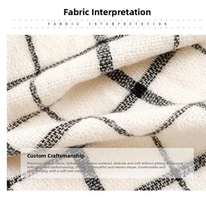 Close-up of soft black and beige plaid fabric texture with pilling resistance