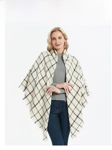 Close-up of black and white checkered shawl with fringe detail on a model