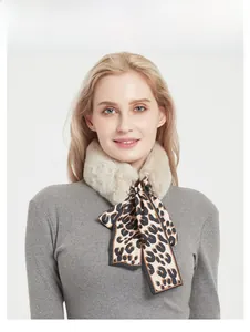 Detail of faux rabbit fur collar stitched with leopard print silk scarf accessory