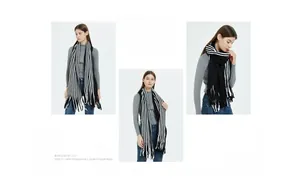 Detail shot of black and white striped knit scarf with soft fringe edges and woven texture