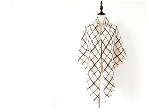 Detail shot of black and white checkered scarf with soft frayed edges and fringe trim