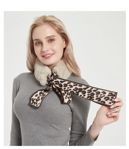 Detailed view of women's leopard print silk scarf with plush faux rabbit fur collar
