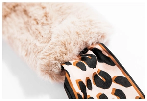 Macro shot of faux rabbit fur scarf with beige texture and leopard print silk fabric detail