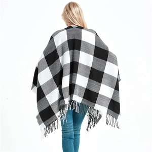 Women's black and white buffalo plaid shawl with fringe tassels and split front design