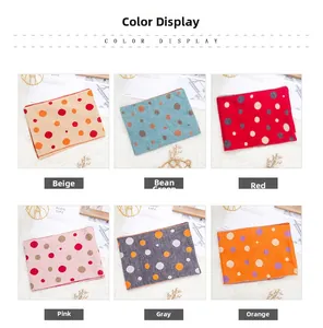 Detailed color selection showing six polka dot knit scarves in various trendy autumn hues