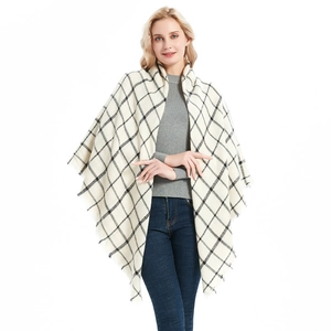 Plaid cashmere-like acrylic shawl with fringe hem shown on a model for winter styling