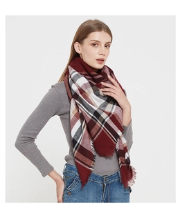 Classic burgundy plaid shawl scarf for women with fringe edges on simple white background