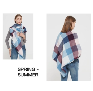 Detail of plaid scarf featuring pastel Scottish check patterns and soft fringe edges