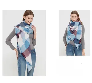 Detail of multi-color plaid scarf featuring soft frayed edges and elegant checkered pattern