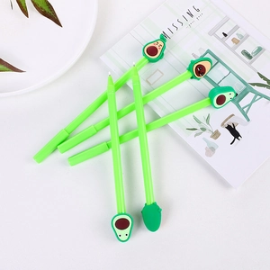 Set of four cute green avocado gel pens with unique cartoon expressions on white desk