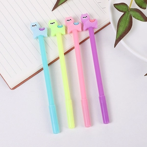 Cute alpaca cartoon gel pens in macaron colors on a desk with a notebook and plant