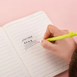 Bamboo shaped green gel pen with 0.5mm tip writing smoothly on notebook for office