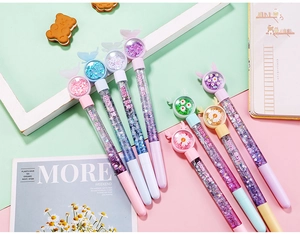 Detail of macaron sequin liquid pens featuring glitter sand and unique 3D pen cap charms