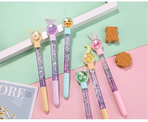 Macro shot of liquid glitter pens with purple sequins and cute cartoon animal toppers