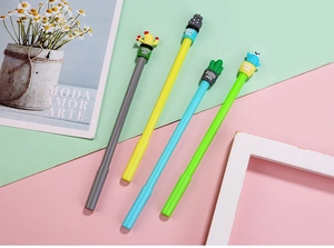 Close-up of four colorful cactus-themed pens with silicone toppers on pastel background