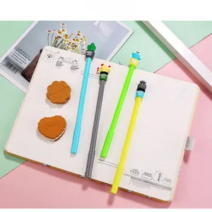 Flat lay of colorful cactus-themed pens with sunny day text on modern desk setup