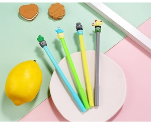 Detailed view of four cactus-themed gel pens in vibrant colors on a creative stationery layout