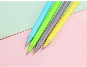 Detail shot showing four colorful cactus-shaped pens with fine needle tips on a split background