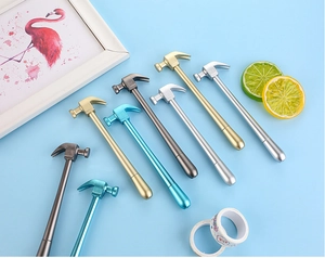 Detail of hammer-shaped creative pens with metallic finish in various colors on blue background