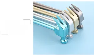 Close-up of four hammer-shaped pens showing metallic finishes and claw head details