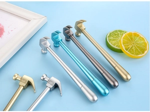 Detail of hammer-shaped pens with metallic finish and engraved numbers in multiple colors