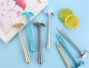 Detail shot of creative hammer-shaped pens in metallic gold, blue, grey, and silver colors