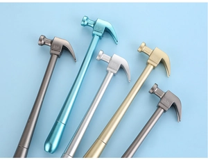 Detail view of five creative hammer-shaped pens in metallic finishes on blue background