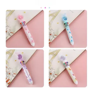 Close-up of 10-color retractable butterfly pens with sequins and decorative bow details