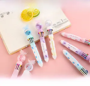 Macro detail of 10-color retractable ballpoint pen with pink butterfly sequin top