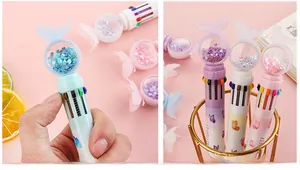Detail of 10-color retractable ballpoint pen with flowing heart sequins and butterfly topper