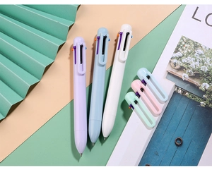 Detail of multi-color macaron retractable pens showing colorful sliders and stylish clips