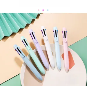 Close-up of six macaron-colored multi-color ballpoint pens with portable clips