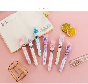 Detail of multi-color retractable butterfly ballpoint pens set on a pastel background