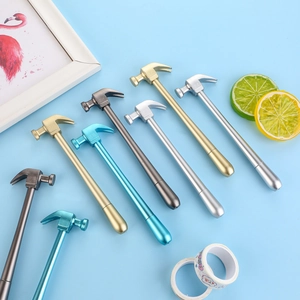 Creative hammer-shaped gel pens in metallic colors displayed on a light blue background