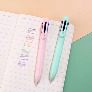 Macaron 6-in-1 retractable ballpoint pen set showing six colors on a white notebook