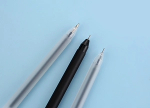Close-up of fine needle tip neutral pens with matte and translucent barrels