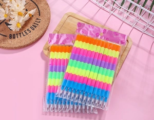 Detail of colorful stackable block pencils in transparent packaging with floral cards