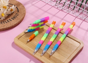Close-up of colorful rainbow building block pencils with segments in a wooden tray