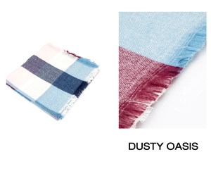 Detail of plaid scarf featuring long fringes and soft mixed fabric texture in dusty pink