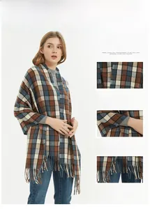 Detail of retro checkered scarf showing soft texture, fine stitching and tassel hem
