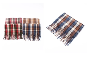 Close-up of winter thick plaid scarf tassels in various British style color patterns