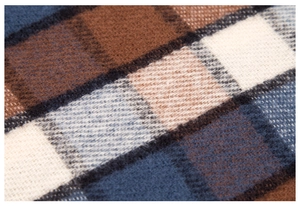 Macro shot of plaid checkered scarf fabric showing soft cashmere texture and fiber weave