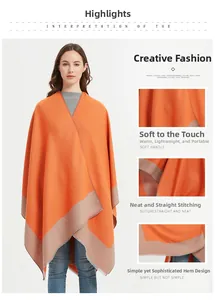 Detailed view of the soft knit orange shawl with cream border and fine stitching