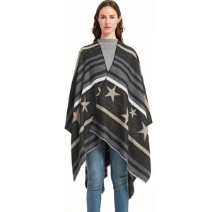 Women's knit poncho wrap with star patterns, striped design and fringe hem detail