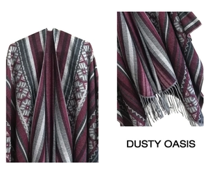 Detail shot of the geometric jacquard knit shawl with burgundy tassels and texture