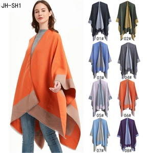Women's solid color split poncho in various dual-side color options for travel wear